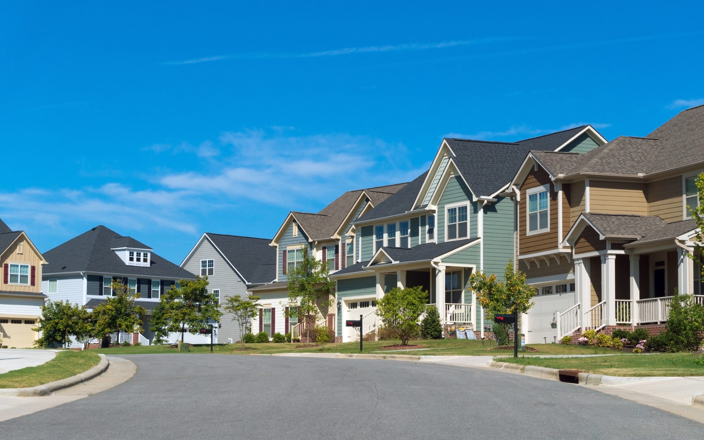 Row of new suburban homes along a residential street