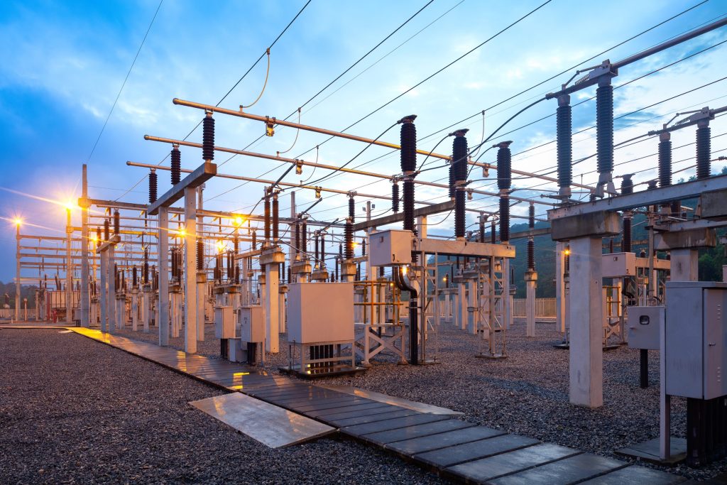 Electrical substation with lights on at dusk